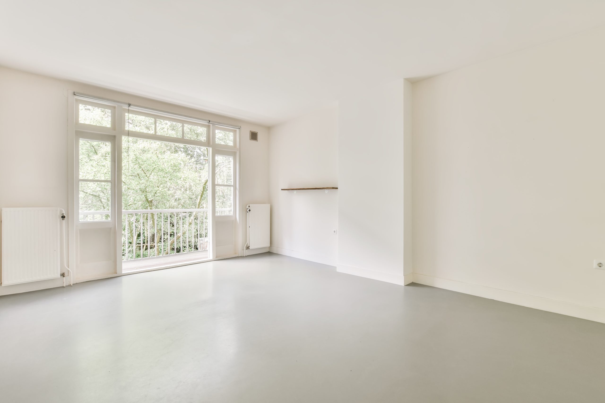 Beautiful renovated empty white room interior with windows